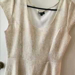 Walk in the room dripping in gold with this dress!